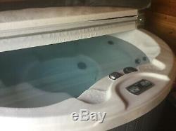 Hot tub Aspen spa 4 seat witl build in Led lights, has 4 cup holders, in grey